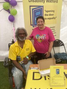 Kumar with Watford Peace Hospice representative at Herts Pride
